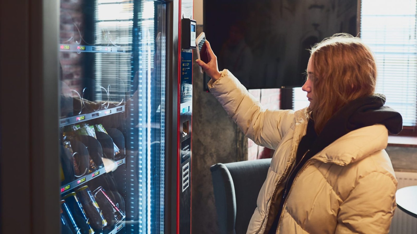 woman-paying-for-product-at-vending-machine