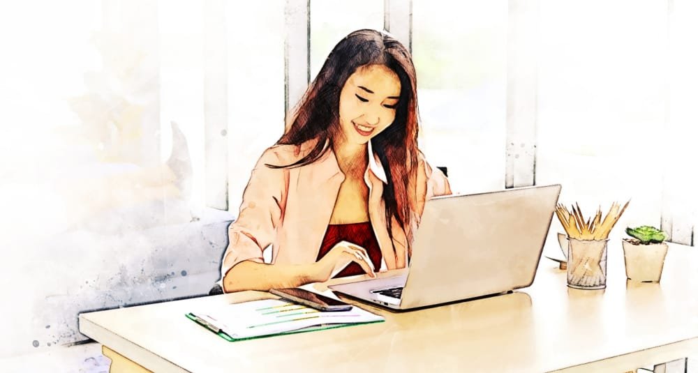 A woman at a desk with a laptop, looking up an LLC name in California.