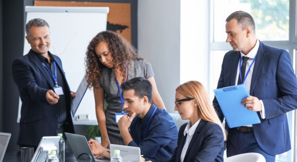 Business people watching a computer screen. How Long Does it Take to Get an LLC in Arizona Featured Image
