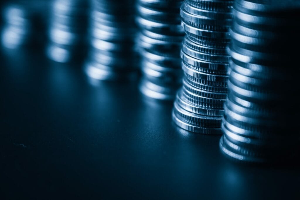 Stacked coins on a table. How to pay yourself from an LLC
