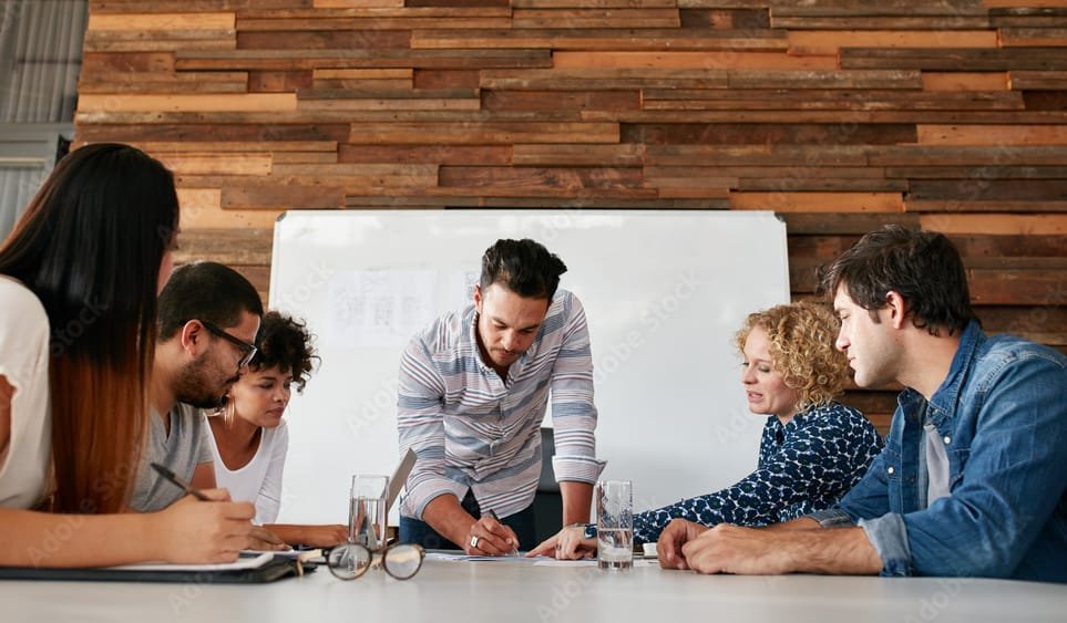 Selection Process. A team of office researchers evaluating registered agent services.